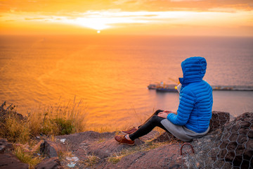 Woman enjoying sunrise 