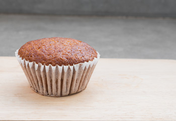 Banana muffin cake on wooden board