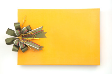 gift yellow box with green ribbon bow on white background