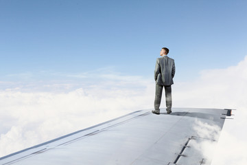 On wing of flying airplane