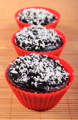 Fresh baked chocolate muffins with desiccated coconut
