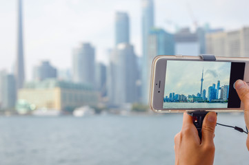 Toronto downtown view through the mobile phone screen © bakerjarvis