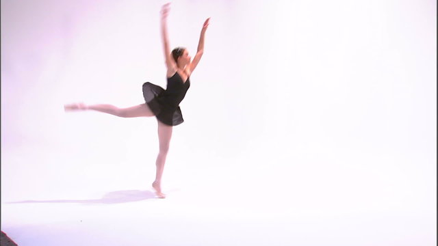 Shot of a ballerina in black dancing.