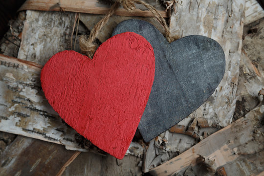 Wooden hearts on wood background