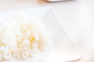 Close up jasmine rice on white dish on table,Thai food style