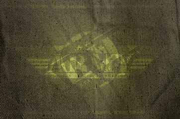 fragment of dense synthetic fabric olive backgtound