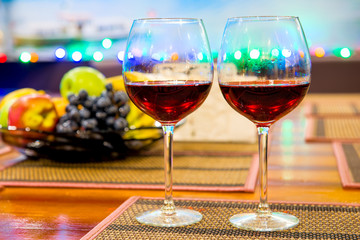 Still Life stemware of wine and fresh fruit on the table