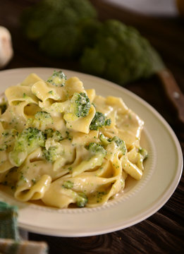 Pappardelle pasta with four cheese sauce and broccoli