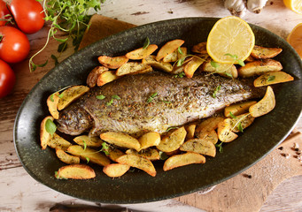Roasted trout with potatoes in thyme