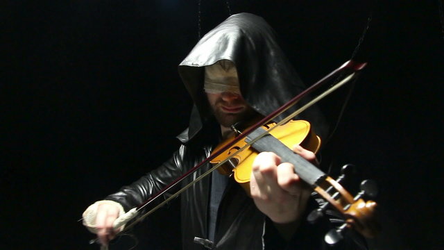 Blind man playing on a violin