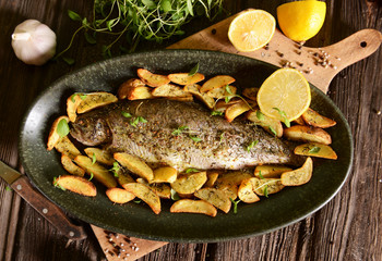 Roasted trout with potatoes in thyme