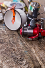 fishing tackles, baits, line with flask, knife and metal cup