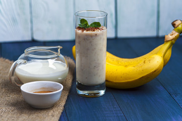 Glass of banana smoothie with mint and chocolate