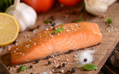 Smoked salmon slice on wooden board
