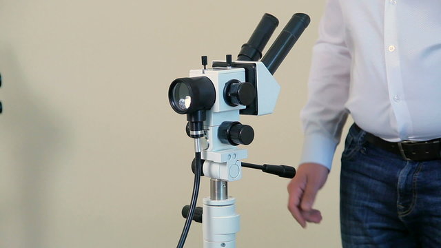 The man next hands up to show colcoscope.