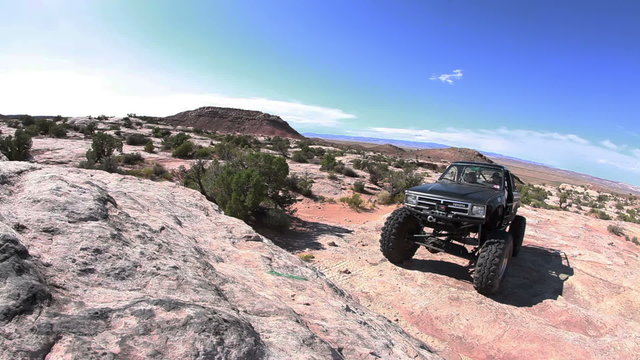 Jeep stuck on rock formation