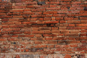 Old red brick wall texture background, Ancient ruins brick wall of old temple in thailand.