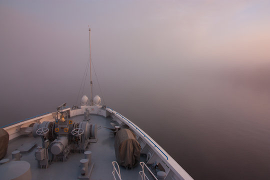 foggy dawn view from the bow of the ship
