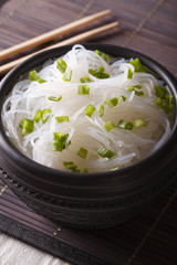 bean thread noodles in a bowl closeup on the table. Vertical
