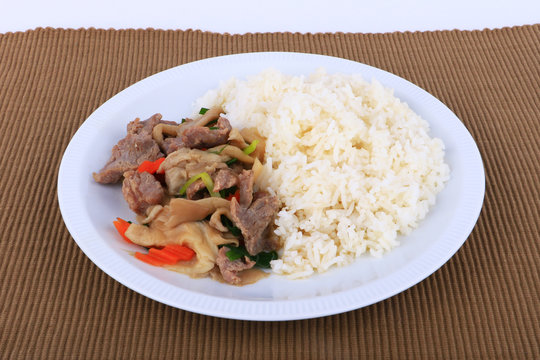 Rice and Fried beef with oyster sauce on white dish, isolated
