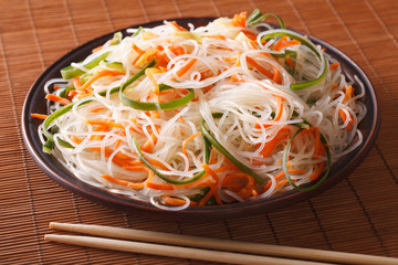 Chinese noodles with cucumber and carrot close-up. horizontal
