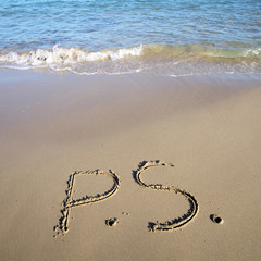 P.S. written on wet sand