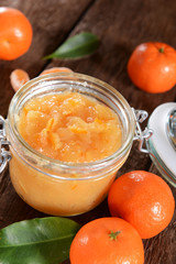 tangerine jam in glass jar