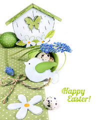 Easter border with blue grape hyacinth and green decorations