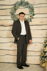 man stands near a Christmas tree. Christmas.