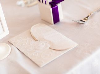 Paper wedding invitation on the table