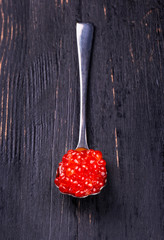 Red caviar in spoon