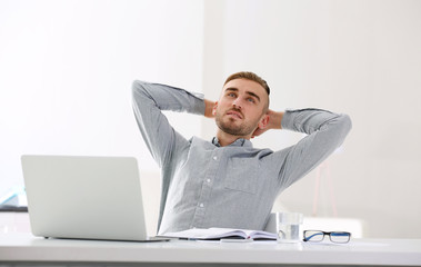 Businessman working with laptop in office