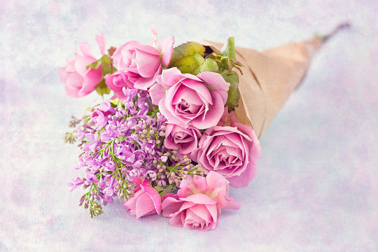 Bouquet of a pink roses on a colorful background .Floral gift for a wedding or birthday.
