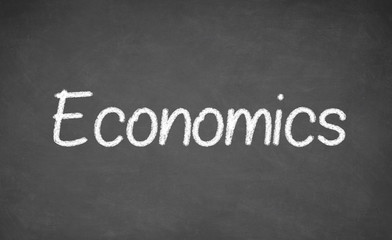 Obraz premium Economics lesson on blackboard or chalkboard.