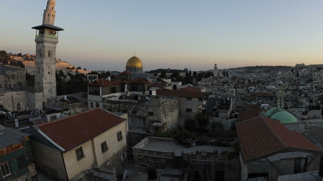 Panning shot of Tracking time-lapse of Jerusalem and the Dome of the Rock at sunset.