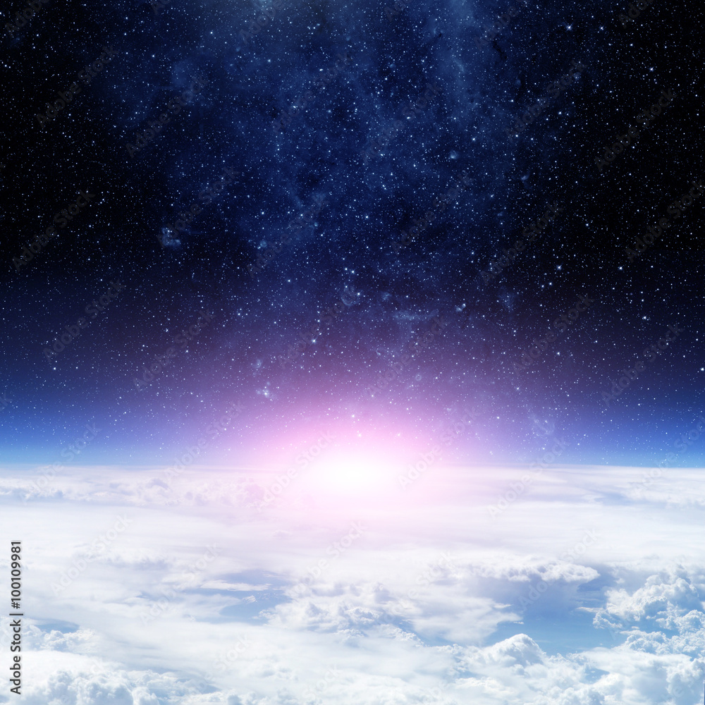 Wall mural clouds of earth planet and star sky on the background. elements of this image are furnished by nasa