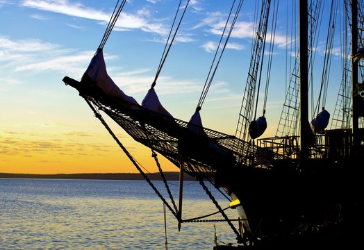 Tall Ship Silhouette. Silhouette Of A Tall Ship Set Against A Sea Sunset Horizon.