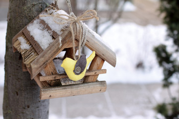 gentle symbol of spring/Made in a soft hand-decorated with a bird feeder house