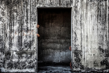 scary abandoned building with ghost hand coming out of a door