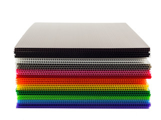 Stack of colorful  corrugated plastic sheets