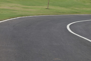 Obraz premium road with green meadow.