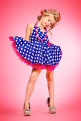 child in polka-dot dress