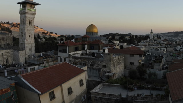 Tracking time-lapse of Jerusalem and the Dome of the Rock at sunset. Cropped.