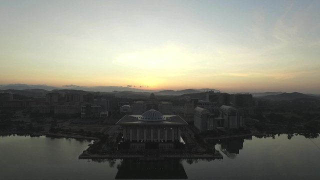 Aerial view of Sultan Mizan Zainal Abidin mosque also known as the Iron Mosque or Masjid Besi and beautiful buildings of Putrajaya during sunrise