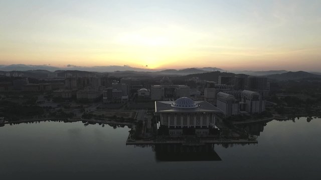 Aerial footage of Sultan Mizan Zainal Abidin mosque also known as the Iron Mosque or Masjid Besi, and and beautiful buildings in Putrajaya taken during sunrise