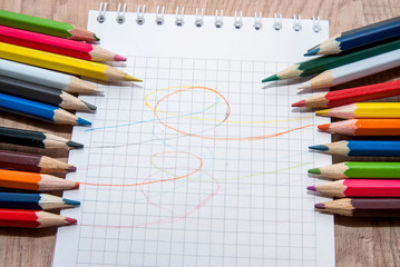 Obraz premium Colored pencils and paper