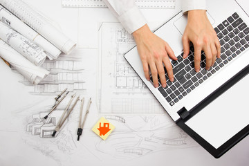 Architect working on blueprint. Architects workplace - architectural project, blueprints, ruler,...