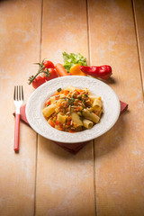 pasta with mixed vegetables and pine nuts