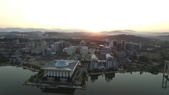 Aerial footage of Sultan Zainal Abidin Mosque also known as the Iron Mosque or Masjid Besi, and the Palace of Justice, Court of Malaysia taken during beautiful sunrise
