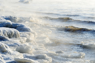 Obraz premium frozen sea view. Waves hitting icy coastline